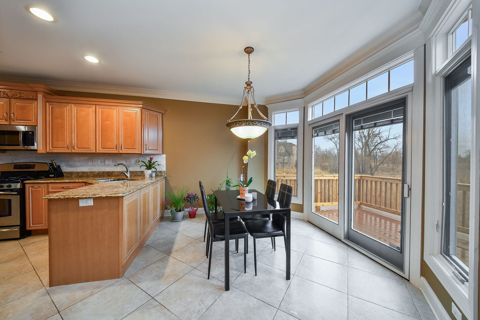 1811 Rizzi Lane, Unit 1811 Bartlett, IL 60103 - Photo 7 of 29 a view of a dining room with furniture window and outside view