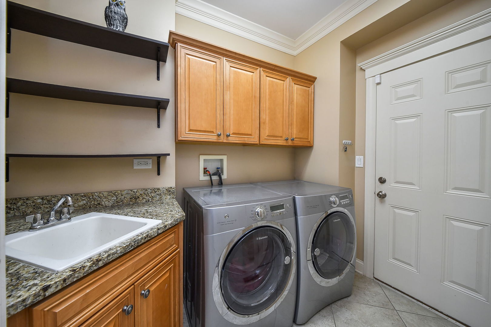 1811 Rizzi Lane, Unit 1811 Bartlett, IL 60103 - Photo 10 of 29 a utility room with sink dryer and washer