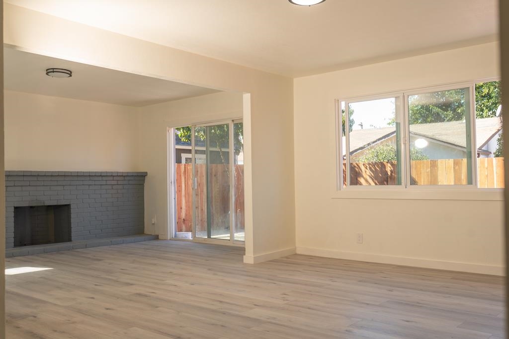 2275 Dover Avenue Fairfield, CA 94533 - Photo 4 of 9 an empty room with wooden floor and windows