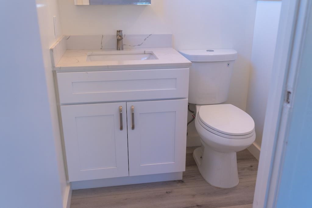 2275 Dover Avenue Fairfield, CA 94533 - Photo 8 of 9 a bathroom with a sink a toilet and a mirror