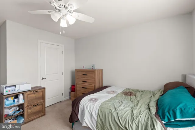 a bathroom with a sink and mirror with toilet