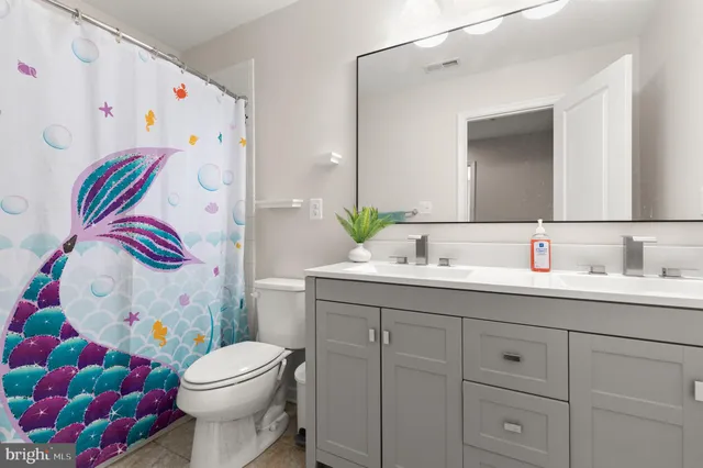 a view of a patio with iron fence