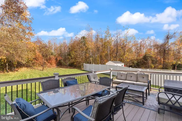 a view of balcony with furniture and trees