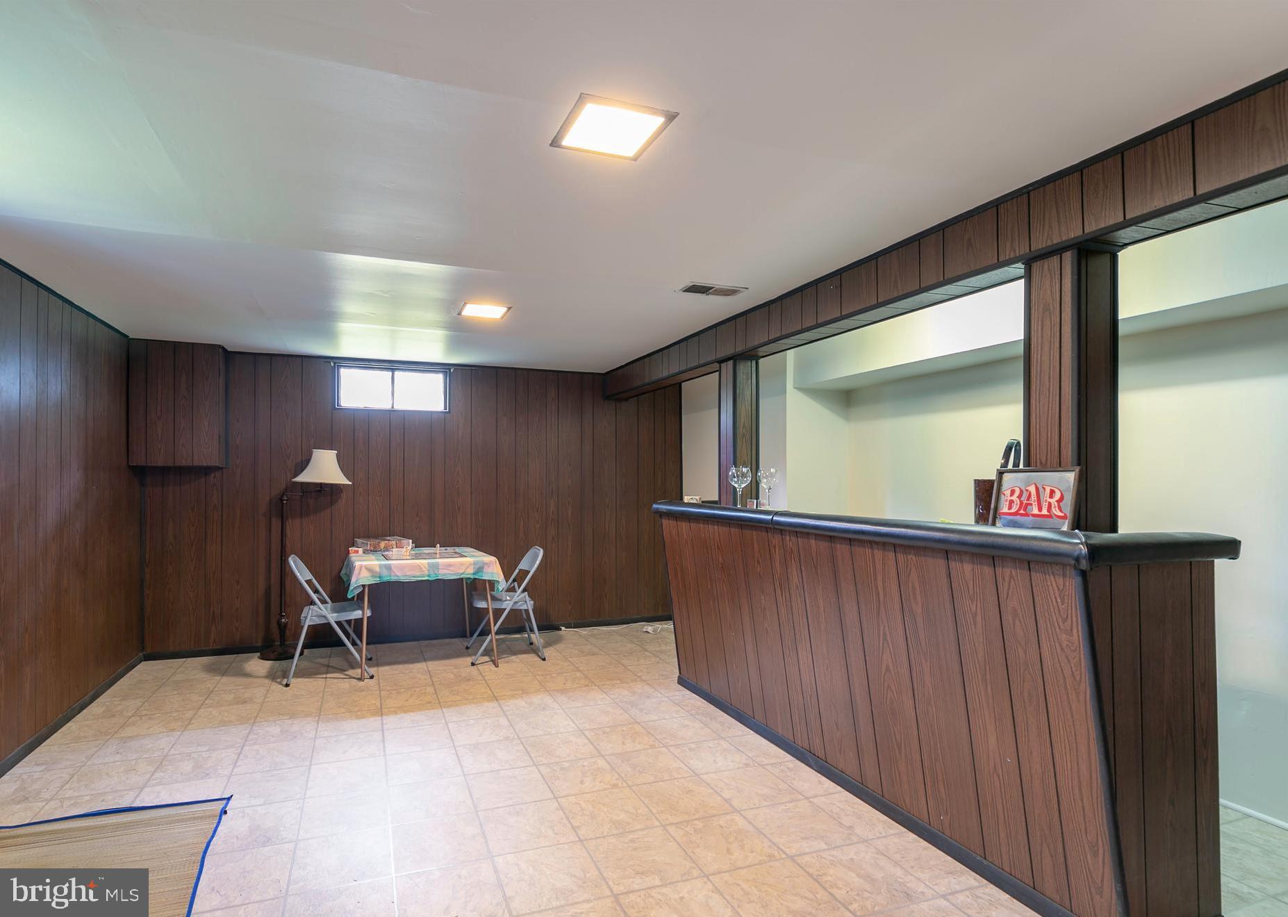 1307 N Road Severna Park, MD 21146 - Photo 16 of 32 Rec room with built in bar and new flooring