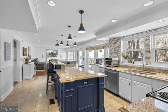 a large kitchen with lots of counter space and a sink