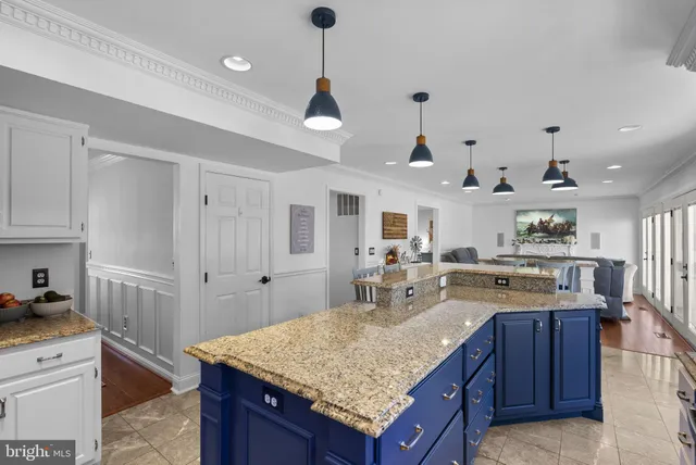 a kitchen with granite countertop cabinets and sink