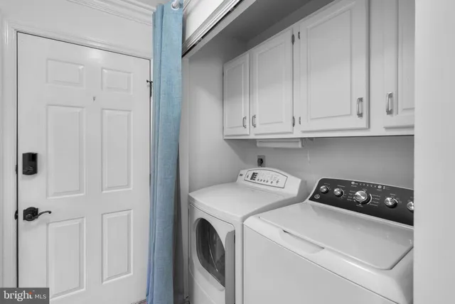 a view of storage and utility room with washer and dryer