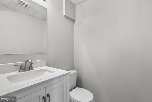 a bathroom with a sink and toilet