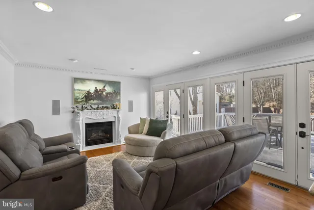 a living room with furniture or fireplace and a wooden floor