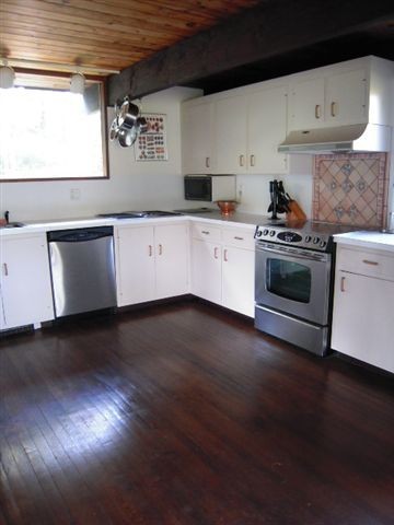 5 Butler Road Stockbridge, MA 01262 - Photo 11 of 22 a kitchen with granite countertop a stove and a wooden floors
