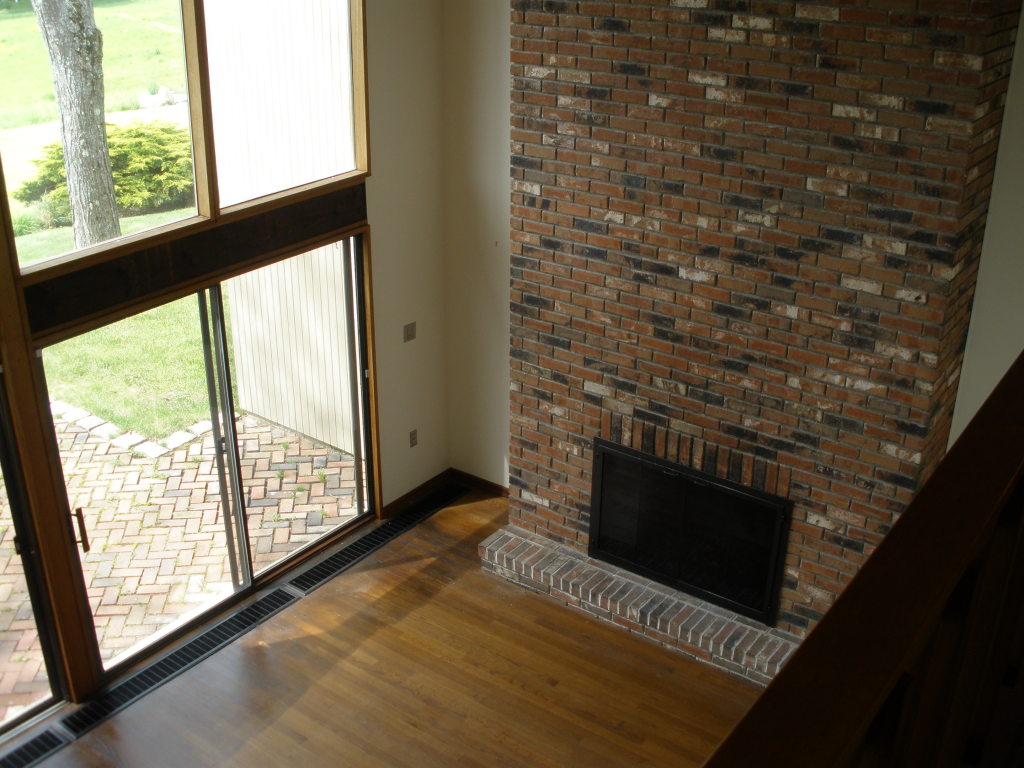 5 Butler Road Stockbridge, MA 01262 - Photo 12 of 22 a view of an empty room with wooden floor and a fireplace