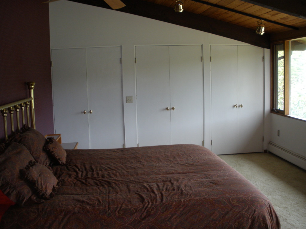 5 Butler Road Stockbridge, MA 01262 - Photo 16 of 22 a bedroom with a bed and a window