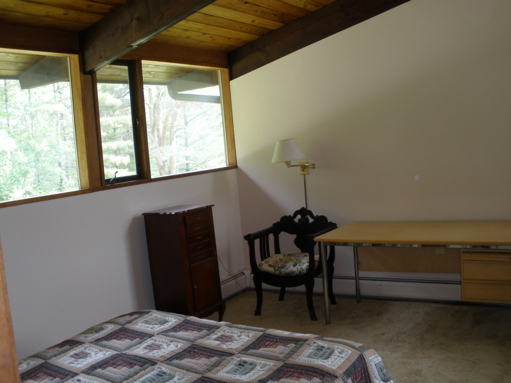 5 Butler Road Stockbridge, MA 01262 - Photo 19 of 22 a bedroom with a bed and a window