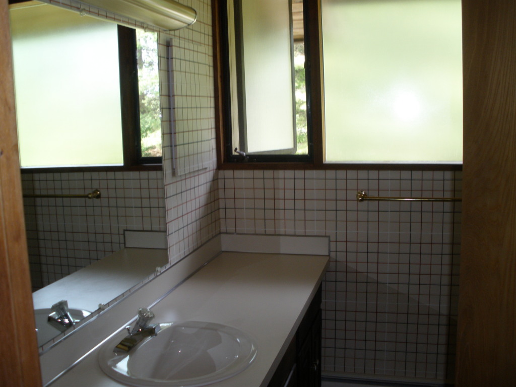 5 Butler Road Stockbridge, MA 01262 - Photo 20 of 22 a bathroom with a sink a toilet and mirror