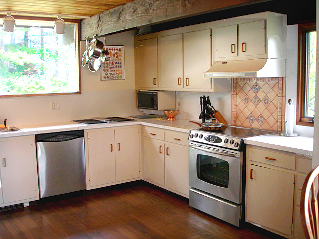 5 Butler Road Stockbridge, MA 01262 - Photo 10 of 22 a kitchen with granite countertop white cabinets and white appliances