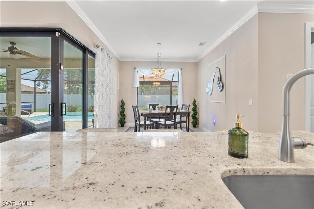 8081 Dimstead Street Port Charlotte, FL 33981 - Photo 13 of 42 a view of a livingroom with furniture and floor to ceiling window