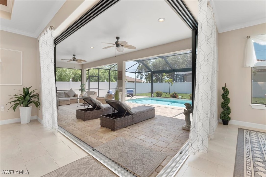 8081 Dimstead Street Port Charlotte, FL 33981 - Photo 16 of 42 a living room with patio furniture and a large window