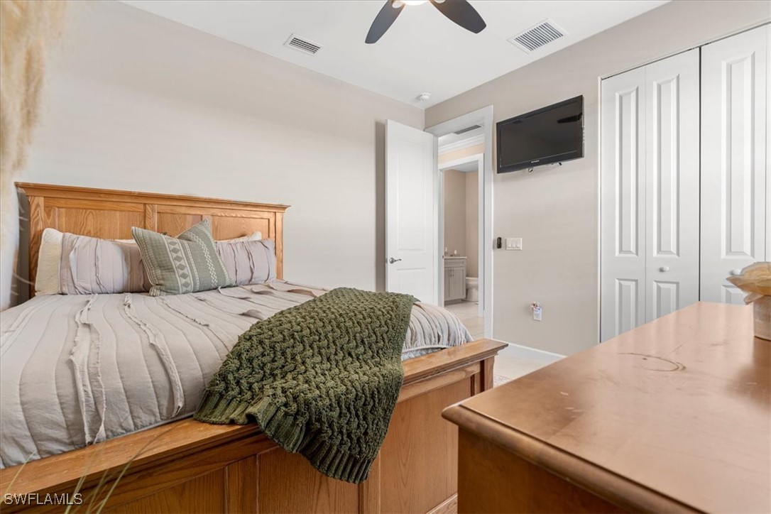 8081 Dimstead Street Port Charlotte, FL 33981 - Photo 18 of 42 a bedroom with a bed and a dresser