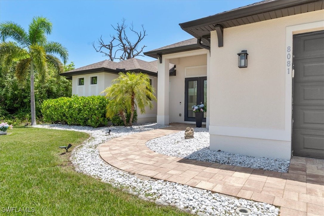 8081 Dimstead Street Port Charlotte, FL 33981 - Photo 2 of 42 a view of a house with a yard