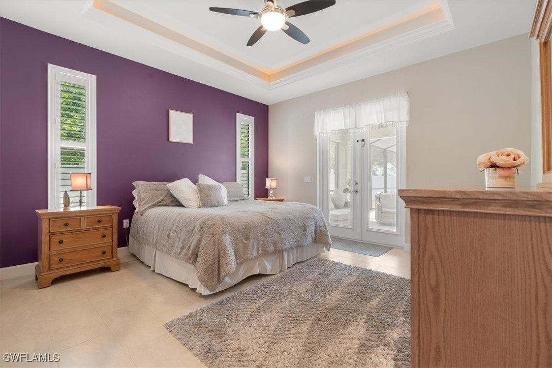 8081 Dimstead Street Port Charlotte, FL 33981 - Photo 22 of 42 a spacious bedroom with a bed and a dresser