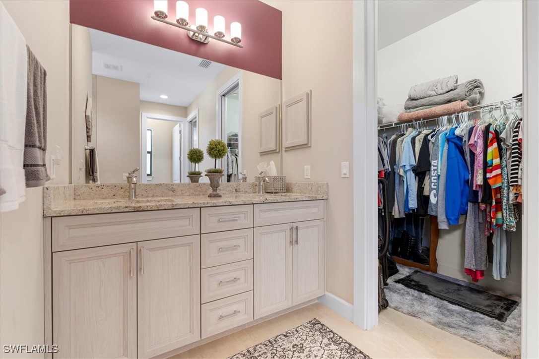 8081 Dimstead Street Port Charlotte, FL 33981 - Photo 26 of 42 a bathroom with a sink and a mirror