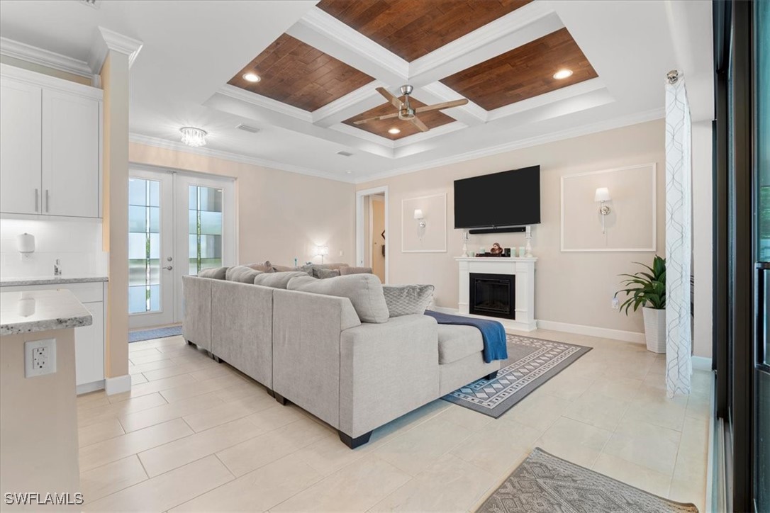 8081 Dimstead Street Port Charlotte, FL 33981 - Photo 7 of 42 a living room with furniture a flat screen tv and a fireplace