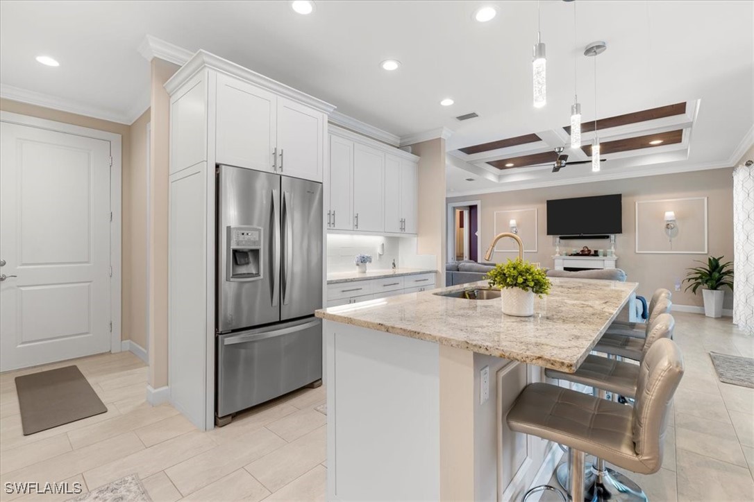 8081 Dimstead Street Port Charlotte, FL 33981 - Photo 8 of 42 a kitchen with kitchen island a counter top space appliances and cabinets