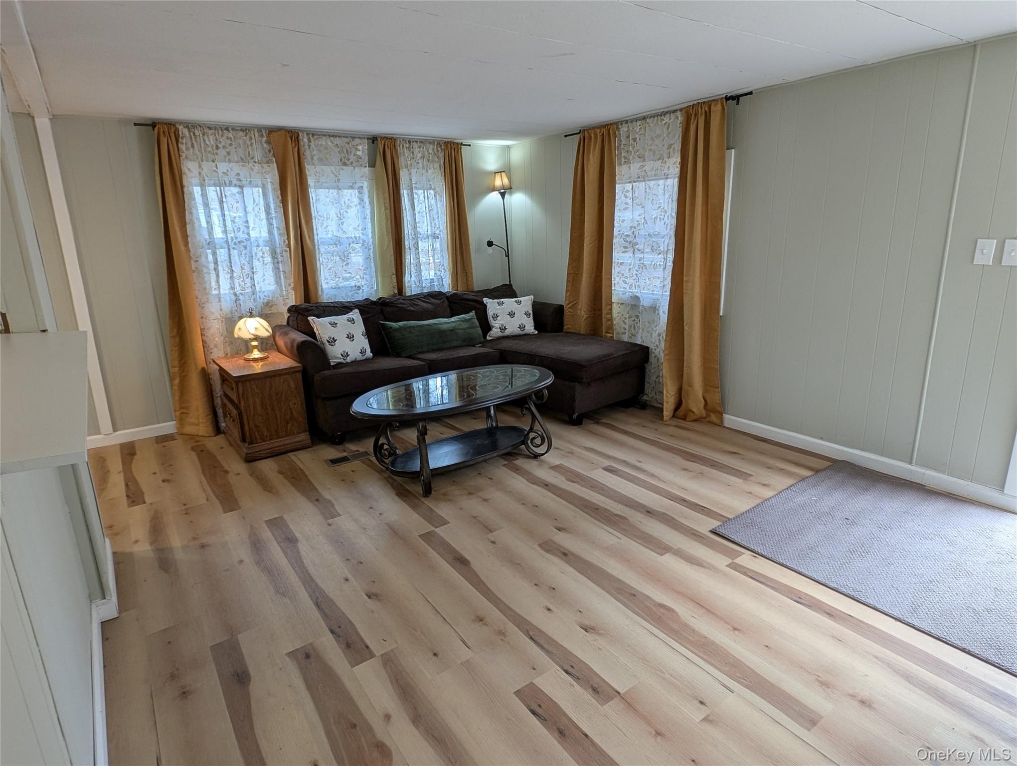 549 Hearts Content Road Cairo, NY 12473 - Photo 11 of 28 a living room with furniture and a wooden floor