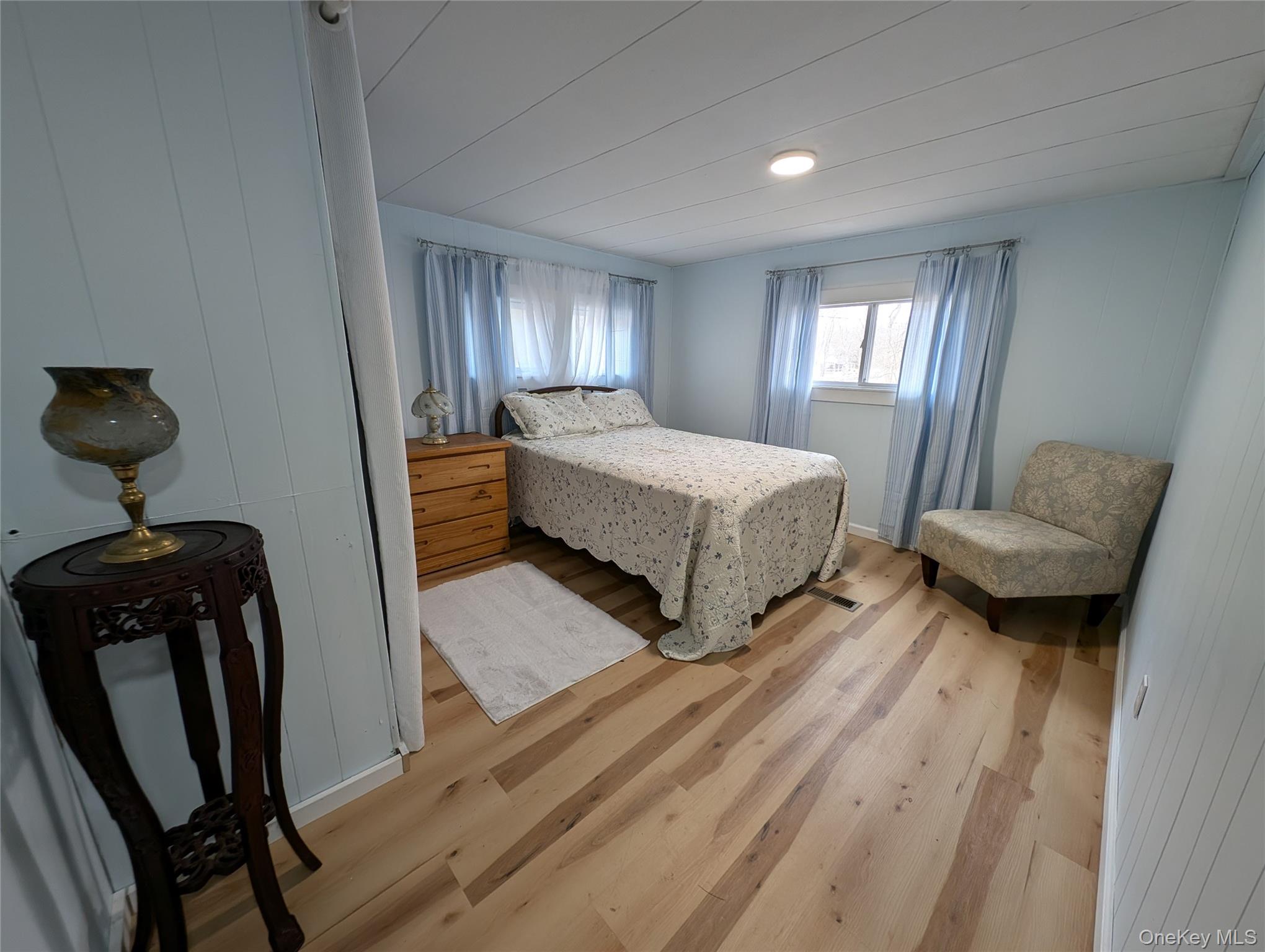 549 Hearts Content Road Cairo, NY 12473 - Photo 15 of 28 a spacious bedroom with a bed and a mirror