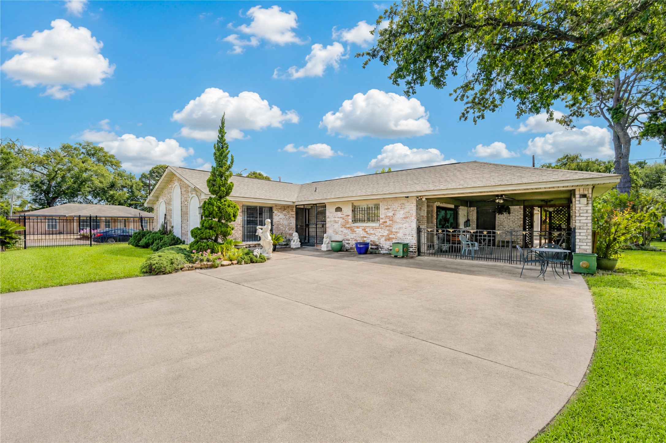 4018 Blalock Road Houston, TX 77080 - Photo 1 of 35 Single-story home set on a beautiful, large lot. Features a distinct, detailed covered patio and fan, a manicured lawn, and meticulous landscaping. Ideal for outdoor entertaining and tranquil living.