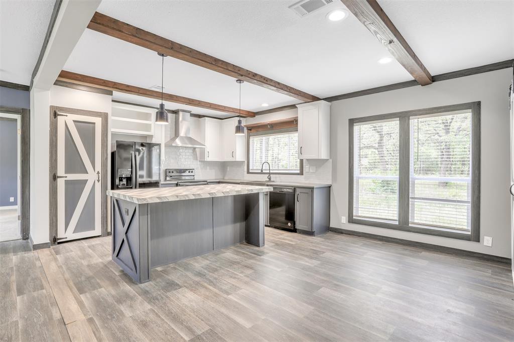 1775 Oak Circle Scurry, TX 75158 - Photo 1 of 1 a large white kitchen with a large window