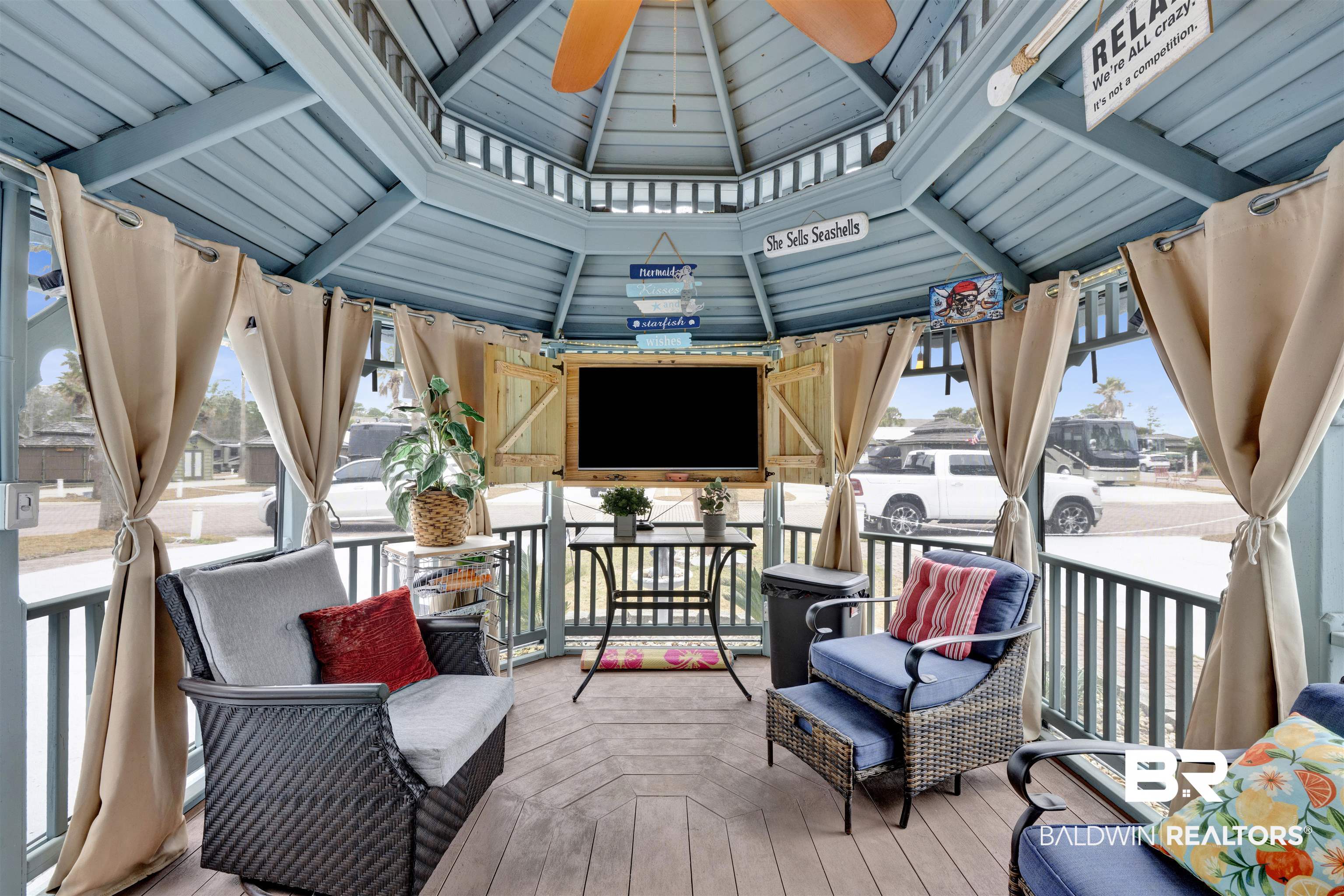 4650 Griffith Marina Road, Unit LOT 24 Orange Beach, AL 36561 - Photo 19 of 34 Wooden deck with ceiling fan