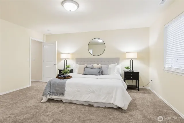 a bedroom with a bed and window