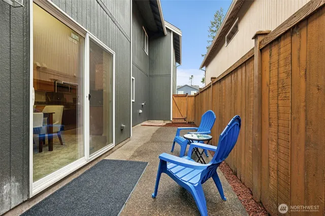 a blue bench sitting in front of a building