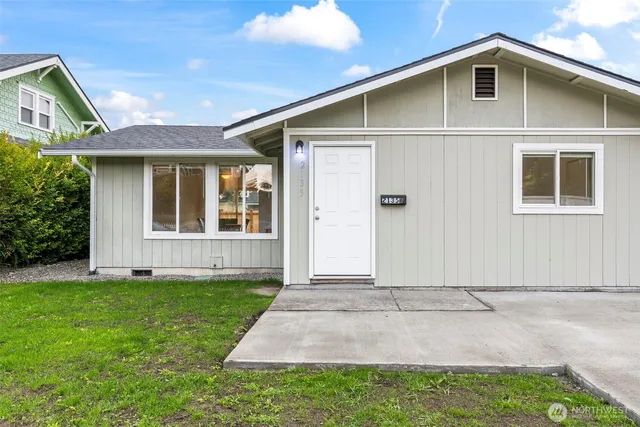 a front view of a house with a yard
