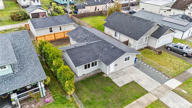 an aerial view of a house with a garden and swimming pool
