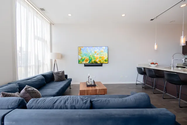 a living room with furniture and a large window