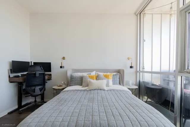 a bedroom with a bed and a window