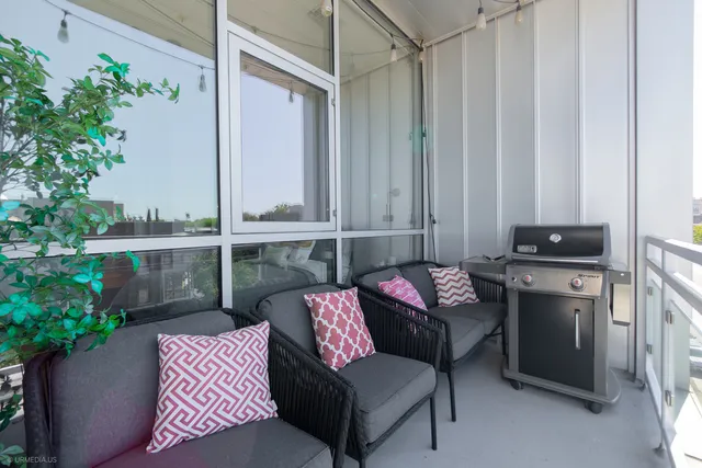 a view of balcony with furniture