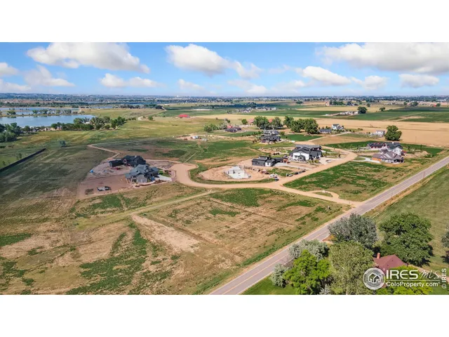 a view of a lake with houses in the back