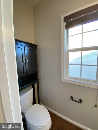 a bathroom with a sink a mirror and a window