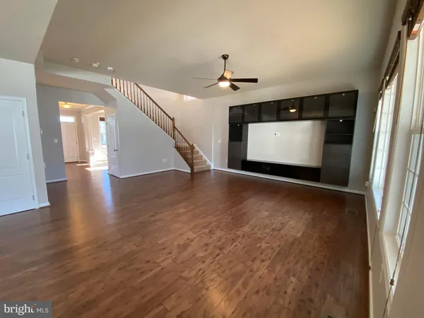 a view of gallery with wooden floor