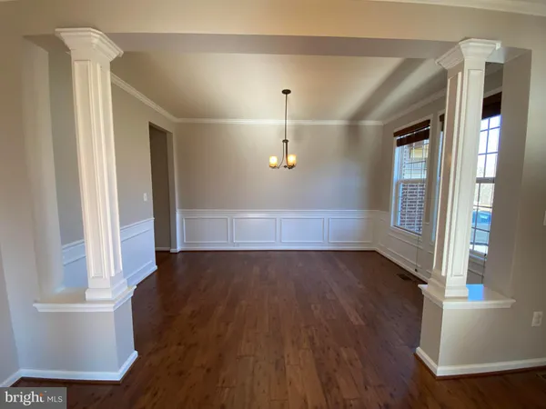 a view of a kitchen from the hallway
