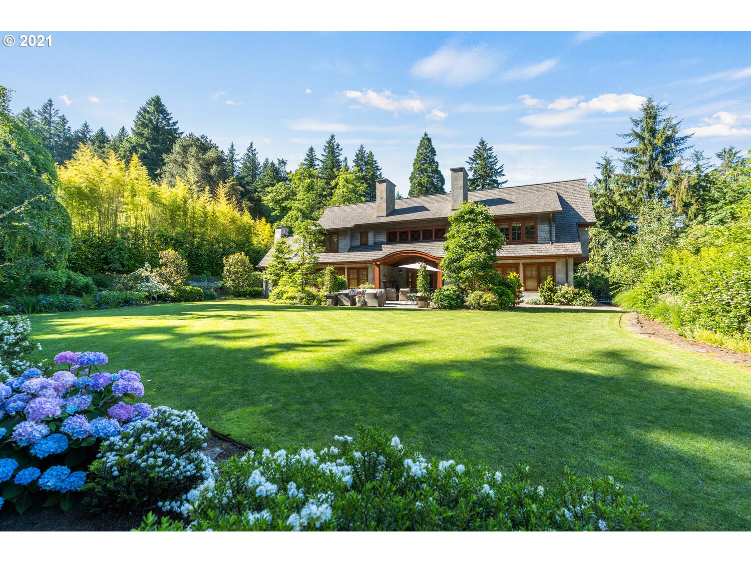 1925 South Military Road Portland, OR 97219 - Photo 1 of 32 a view of building with garden space and swimming pool
