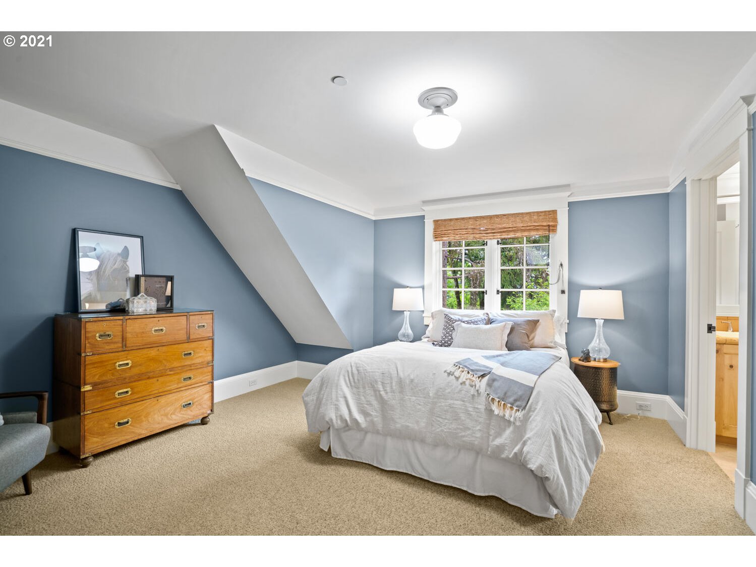 1925 South Military Road Portland, OR 97219 - Photo 19 of 32 a bedroom with a bed and wooden floor