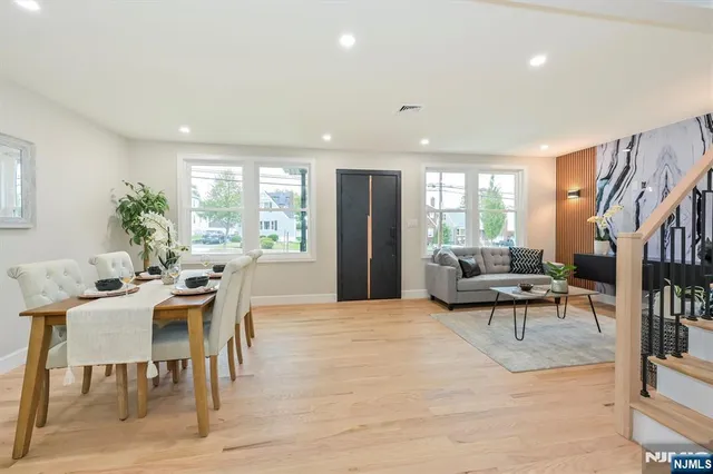 a view of a dining room with furniture and a potted plant