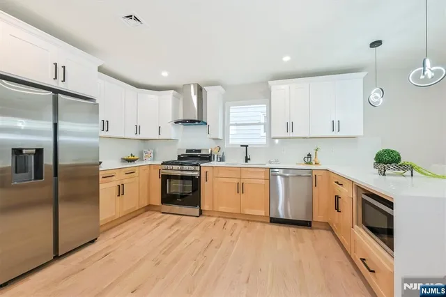 a kitchen with a white cabinets and white appliances
