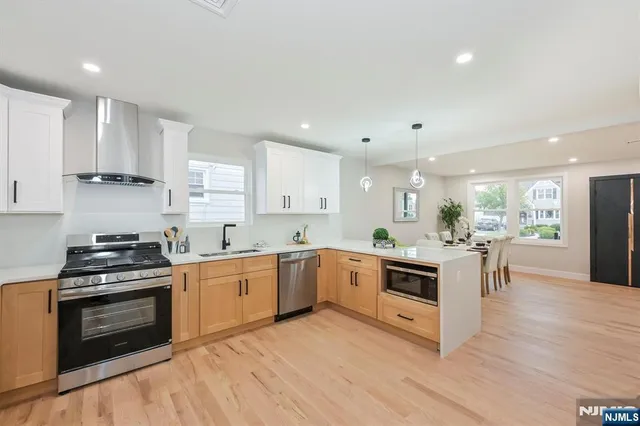 a kitchen with a stove top oven sink and cabinets