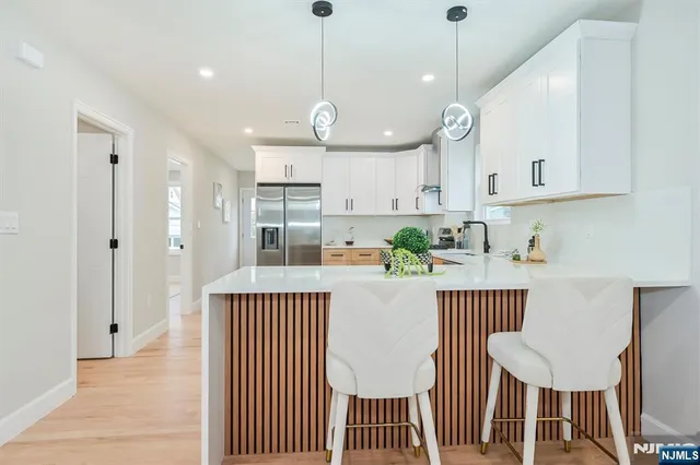 a view of a kitchen and dining room