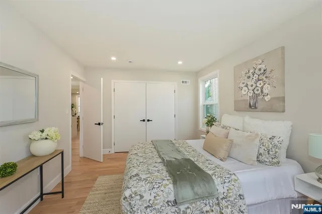 a spacious bedroom with a bed and a couch